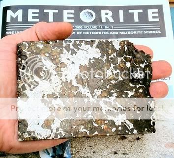 Stony-iron (pallasite) meteorite.
